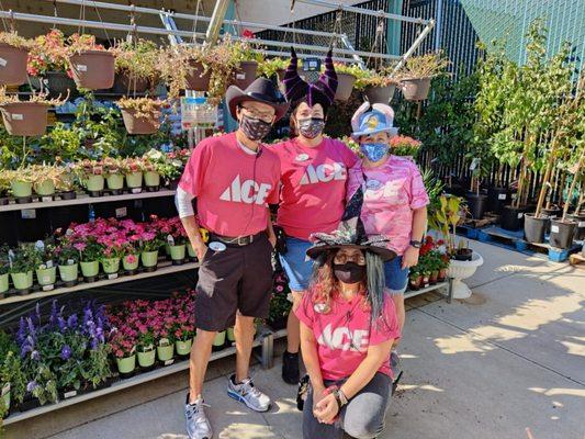 Our Helpful Team celebrating Breast Cancer Awareness - and Halloween- in October outside the Garden Center