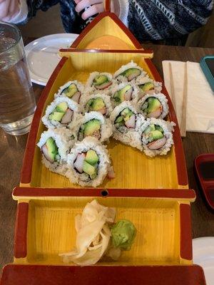 Sushi presentation in boat-style containers (after we'd eaten some).