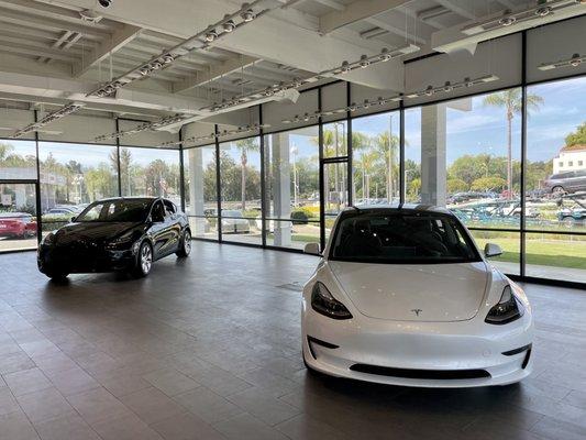 Two cars in showroom