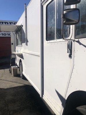 White food truck in lot