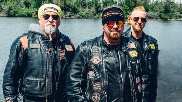 Dan Matzdorff, Pete Leehey, and Jon Jansen - The Biker Lawyers of Cedar Rapids, Iowa, stand by a river.