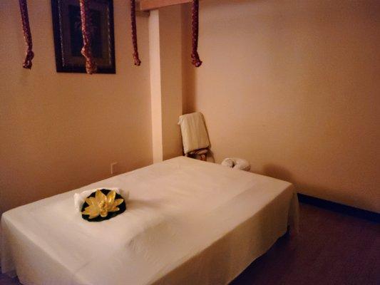 Spacious massage table for Traditional Thai massage with backwalking at your option.