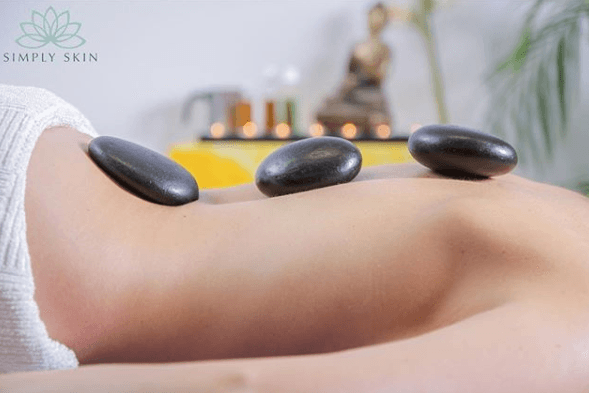 Relax, relieve tense muscles, improve stress and anxiety and promote restful sleep with a hot stone massage at Simply Skin!