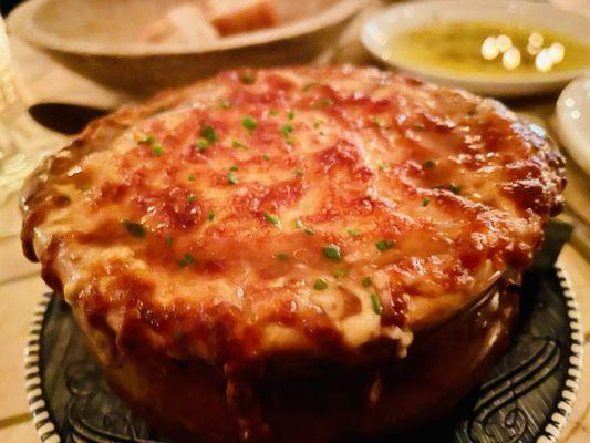 Delicious crock of warm French onion soup on a cold evening