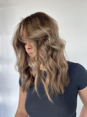 Honey blonde highlights and a layered haircut with face framing pieces