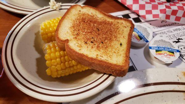 Corn on the cob with garlic toast