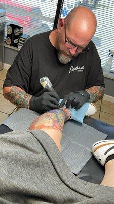 Alex tattooing my leg sleeve