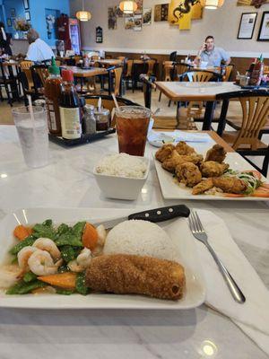 Shrimp and rice with egg roll. And also with egg deop soup.