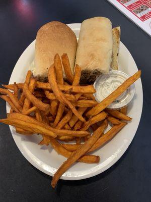 Philly cheese steak sandwich with sweet potato fries