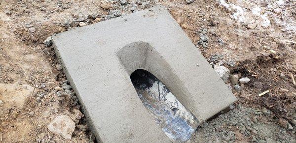 One of four culverts installed at retention pond for Home Depot Warehouse .