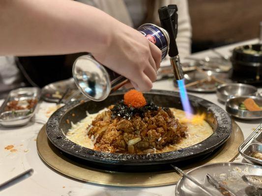 Torching the pan fried rice