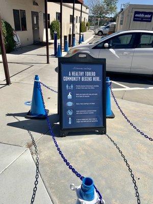 Outside: Safety signage and cones help remind and enforce proper distancing all over the USD campus