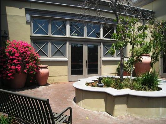 modest garden patio with quatrifoil planter