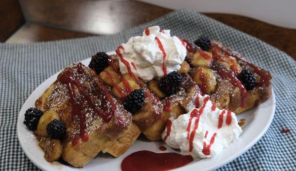 Cinnamon Swirl French Toast With Bananas Foster and fresh berries