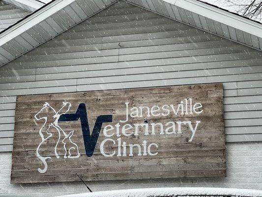 Janesville Veterinary Clinic sign in the falling snow