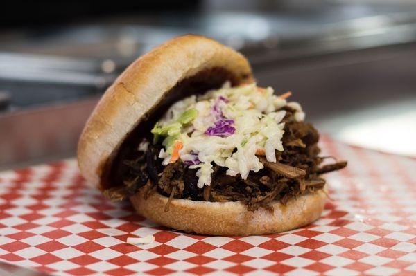 Slow smoked, delicious Beef Brisket sandwich with fresh made Cole slaw on top! Yum!!!