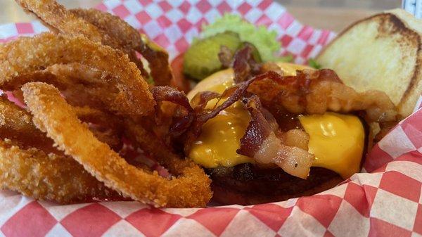 BBQ bacon cheeseburger with onion rings.