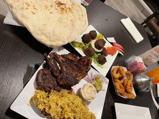 Falafel Appetizer, Lamb Chops with Biryani rice, Fresh Arabic Flatbread, & Onion Rings