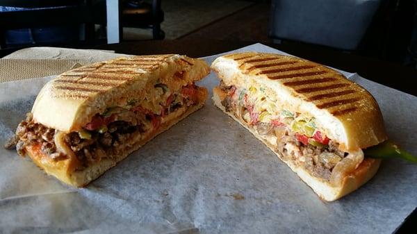 Steak Panini with Chipotle mayo, fresh jalapeños, caramelized onions, peppers and of course hot sauce. Boom. Home run.