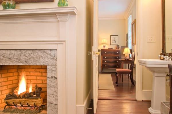 Spacious bathroom  with fireplace opposite the hydro therapy whirlpool tub.