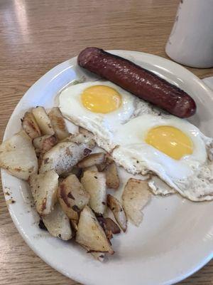 Fried eggs with house fries and kielbasa.