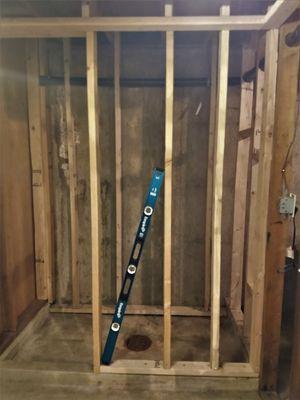 To build a basement bathroom, first Scott and Liz had to frame the space for walls!