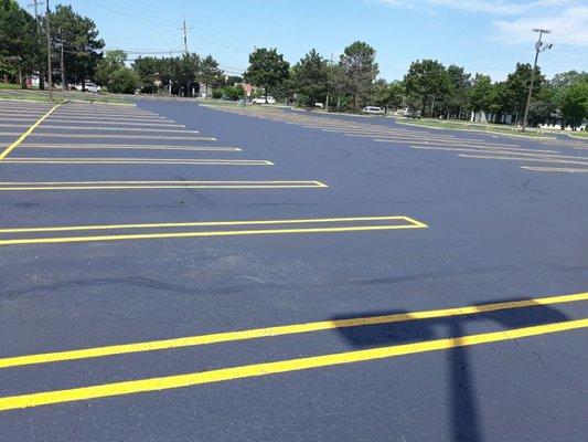 Commercial parking lot sealcoating and striped