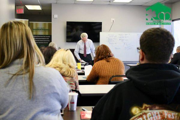 Gene Mulroy teaching his monthly Training Class for new and experienced Realtors