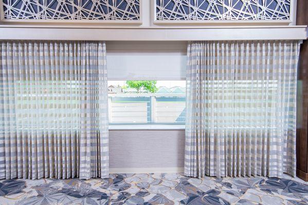 Custom draperies and roller shades at The Meridian in Farmington Hills. They dress up the windows with elegance, & they are motorized!