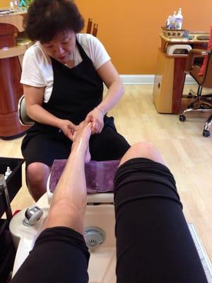 The nail tech begins with a five minute deep tissue foot massage..