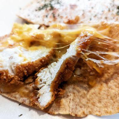 Quesadilla with melted cheese and fried chicken