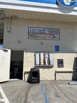 Restrooms are located on the side of the building