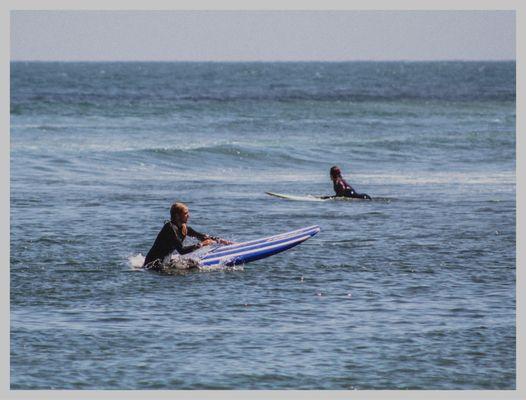 Surfers enjoying the beach