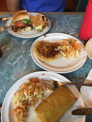 (Bottoms to top) Tamal, pupusa with a pickled cold slaw, and torta