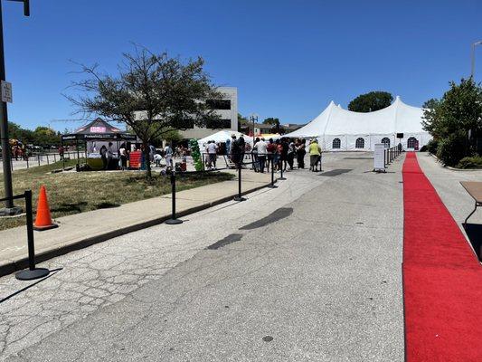 Take the red carpet to the tent where community sponsors, musicians and respite from being outdoors.