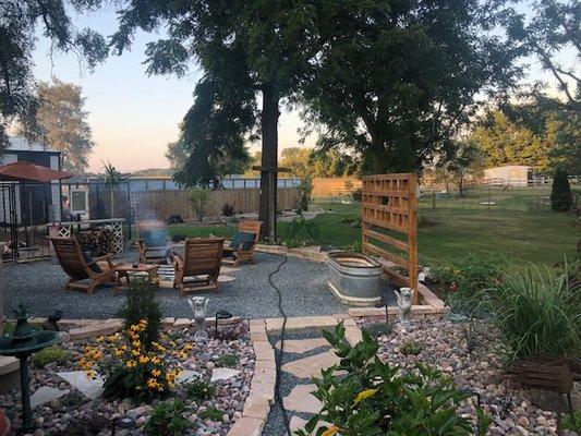 Stone beds with path and stone/rock wall patio for fire ring