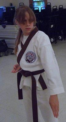 New Brown Belt learns her form