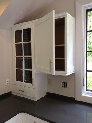 Refinished cabinets installed flush to new counter top.