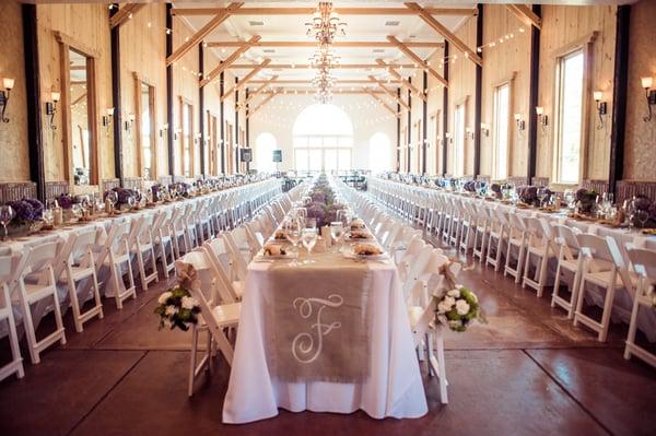 Beautiful farm tables with monogramed runners at Crooked Willow Farm.