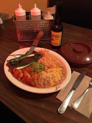 The "Tierra Y Mar." Thin Carne Asada steak, shrimps, rice and beans with some fantastic green onions!...