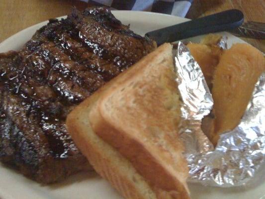 12 oz. Rib eye steak, baked sweet potato and Texas toast