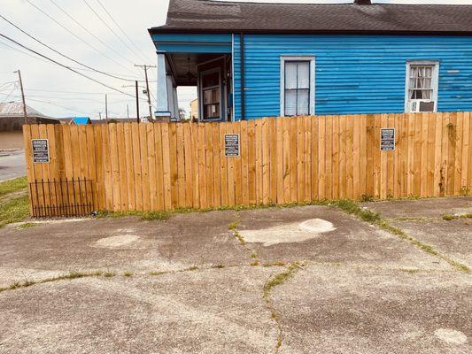 Green Acres signs on my fence.