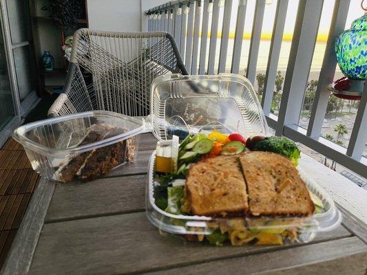 Spicy chicken sandwich with salad  and carrot cake