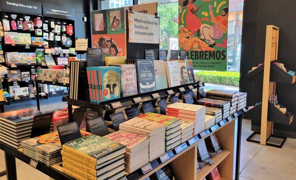 Books in the foreground, trending and launching items against the wall