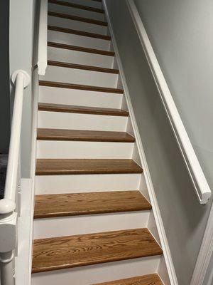 Hardwood stairs stained to match LVP flooring - really beautiful work