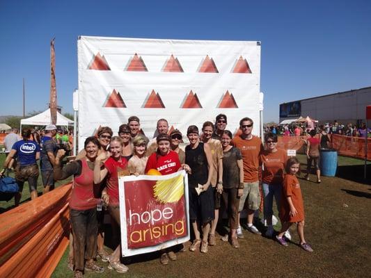 Our team after participating in a Mud Run for charity.