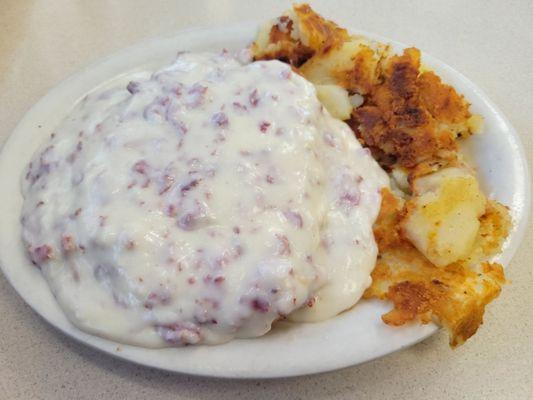 Creamed chipped beef with home fries.