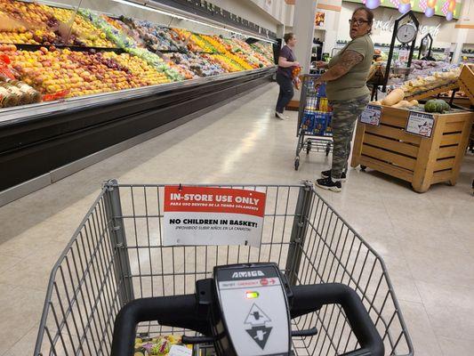 Shopping at Randolph AFB Texas Commissary with a large selection of fresh fruits, vegetables, and meats.