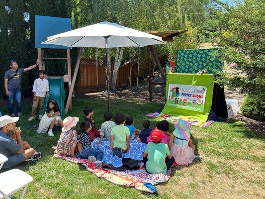 Kids enjoying the puppet show