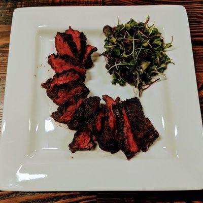 Grilled hanger steak with micro green & shaved radish salad